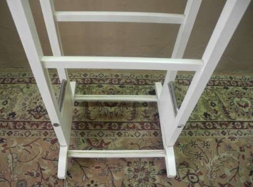 An awesome painted white wooden clothing stand "dumb valet" in good condition.