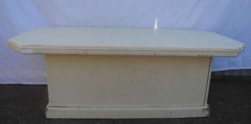 A coffee table for informal living spaces, needs some work or cover.