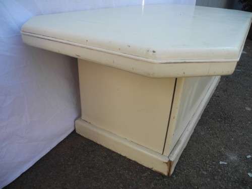 A coffee table for informal living spaces, needs some work or cover.