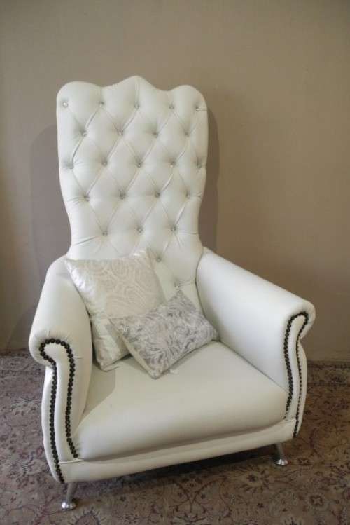 An exceptional oversized King wing back chair in a durable white faux leather. Lifespace Sale