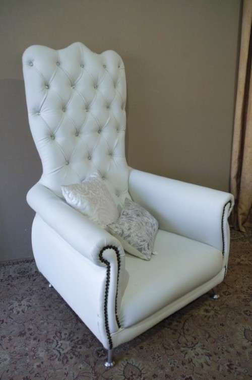An exceptional oversized King wing back chair in a durable white faux leather. Lifespace Sale