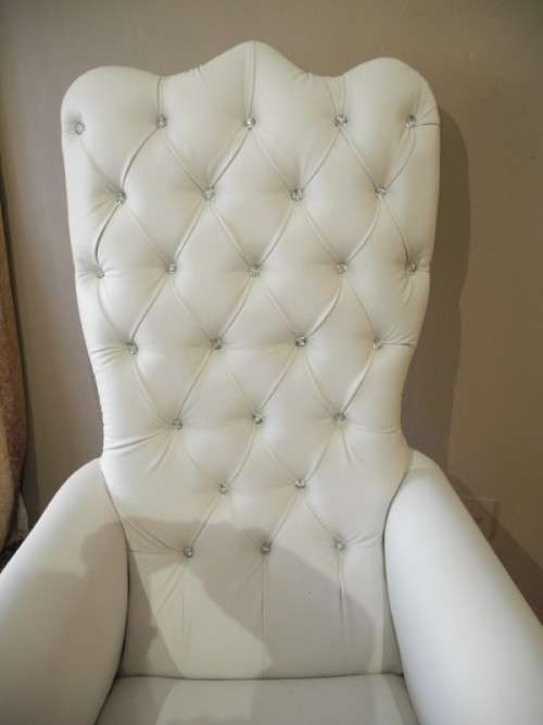 An exceptional oversized King wing back chair in a durable white faux leather. Lifespace Sale