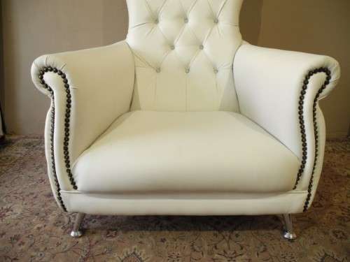 An exceptional oversized King wing back chair in a durable white faux leather. Lifespace Sale
