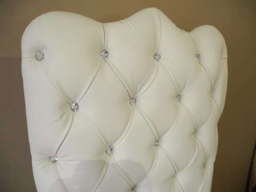 An exceptional oversized King wing back chair in a durable white faux leather. Lifespace Sale