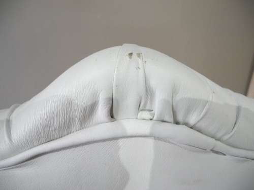 An exceptional oversized King wing back chair in a durable white faux leather. Lifespace Sale