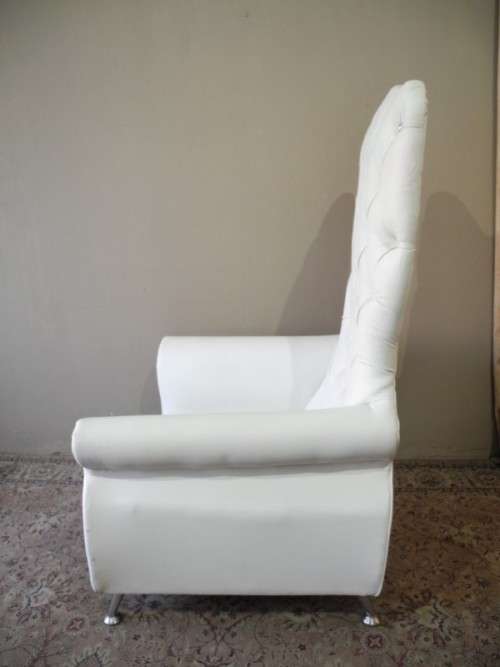 An exceptional oversized King wing back chair in a durable white faux leather. Lifespace Sale