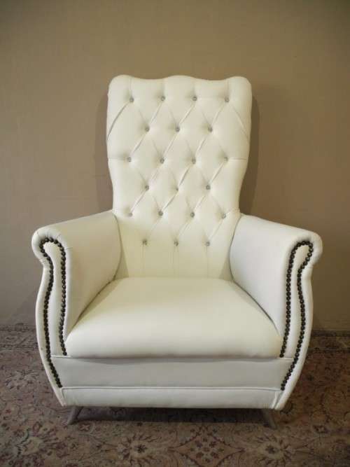 An exceptional oversized Queen wing back chair in durable white faux leather. Great "Feature" chair
