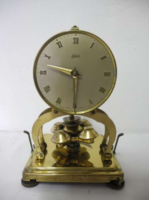 BARGAIN CLOCKS!!A vintage Schatz brass and glass clock. Lifespace Sale
