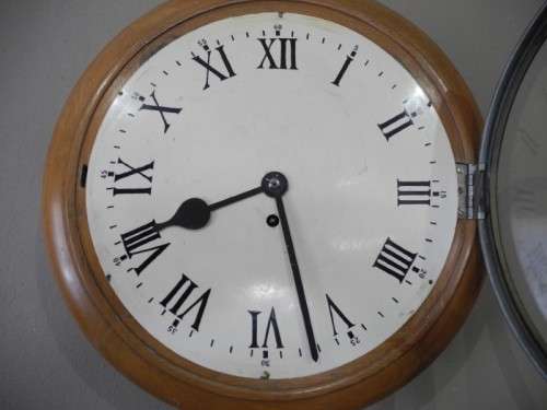 BARGAIN CLOCKS!!A vintage round faced clock in a wood wall casing. Lifespace Sale