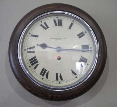 BARGAIN CLOCKS!!A vintage round Schulitis Schwar clock in a wood wall casing. Lifespace Sale