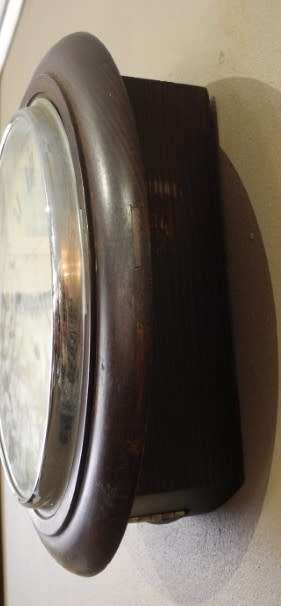 BARGAIN CLOCKS!!A vintage round Schulitis Schwar clock in a wood wall casing. Lifespace Sale