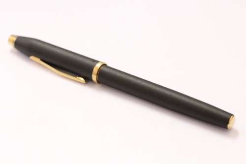 A stunning vintage black with gold trim Cross fountain pen.