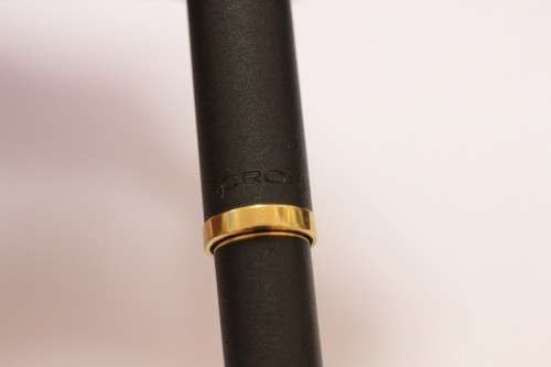 A stunning vintage black with gold trim Cross fountain pen.