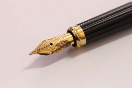 A stunning vintage black with gold trim Cross fountain pen.