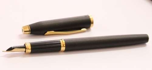 A stunning vintage black with gold trim Cross fountain pen.