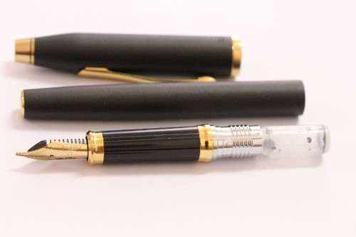 A stunning vintage black with gold trim Cross fountain pen.