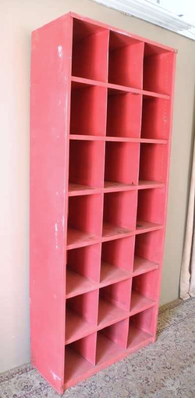 A large red metal cabinet, perfect in a garage, informal living area! Lifespace Sale