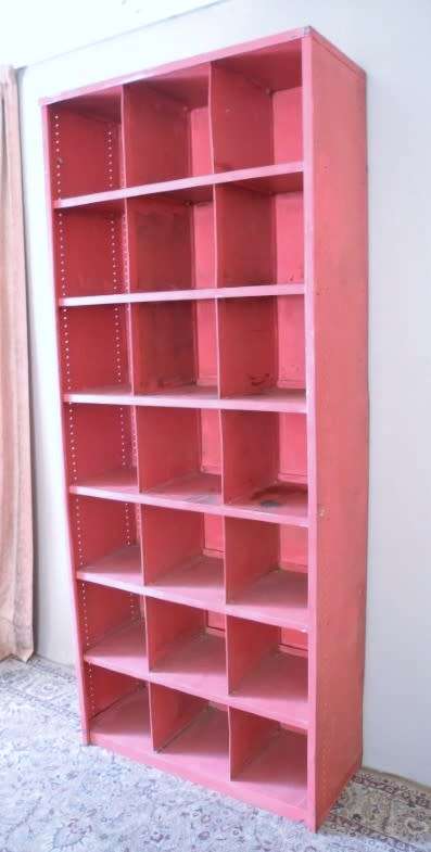 A large red metal cabinet, perfect in a garage, informal living area! Lifespace Sale