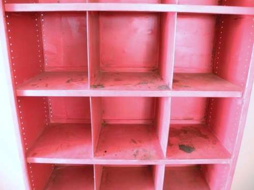 A large red metal cabinet, perfect in a garage, informal living area! Lifespace Sale