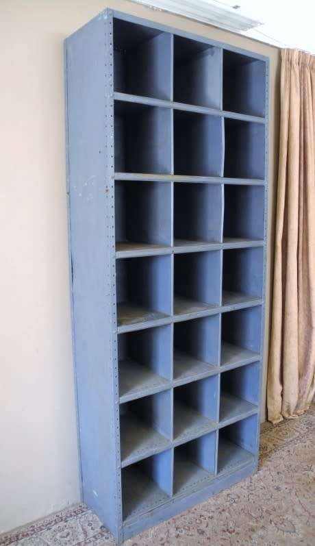 A large grey metal cabinet, perfect in a garage, informal living area! Lifespace Sale