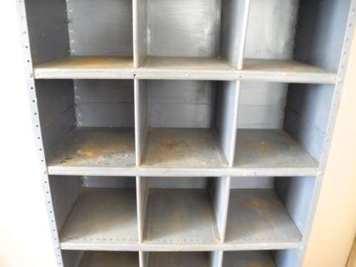 A large grey metal cabinet, perfect in a garage, informal living area! Lifespace Sale