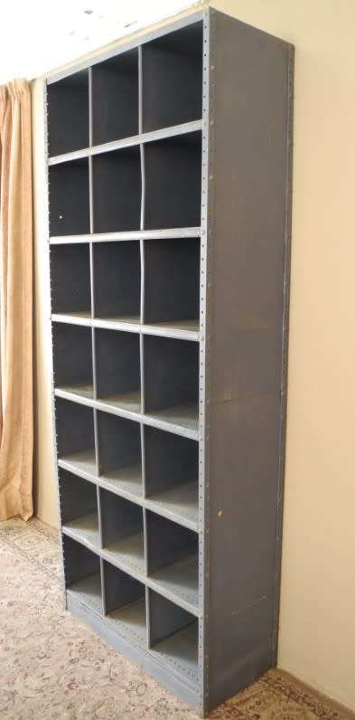 A large grey metal cabinet, perfect in a garage, informal living area! Lifespace Sale