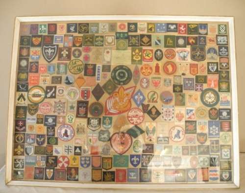 An extra large framed behind glass assortment of Scout badges-Lifespace Sale