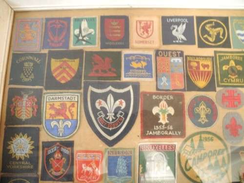 An extra large framed behind glass assortment of Scout badges-Lifespace Sale