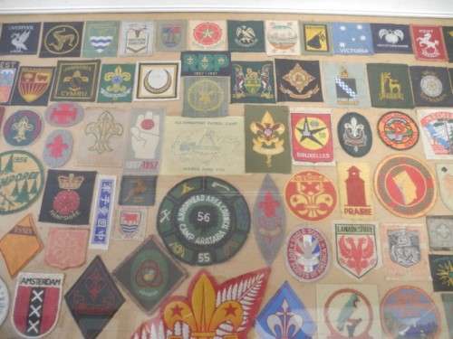 An extra large framed behind glass assortment of Scout badges-Lifespace Sale
