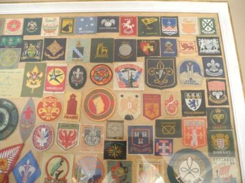 An extra large framed behind glass assortment of Scout badges-Lifespace Sale