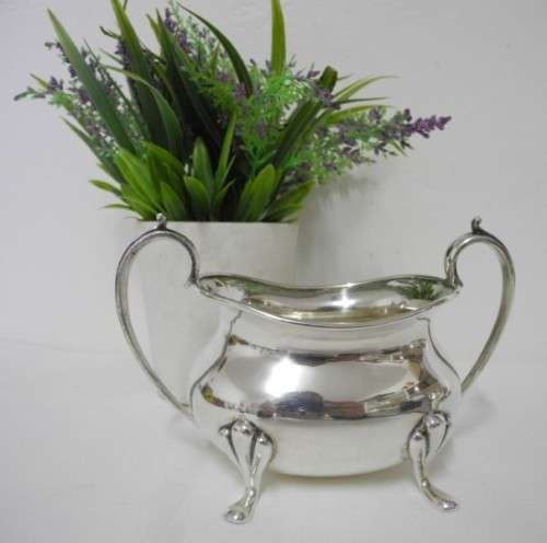 A gorgeous double handled silver plated sugar bowl, stunning on a tea tray, table.