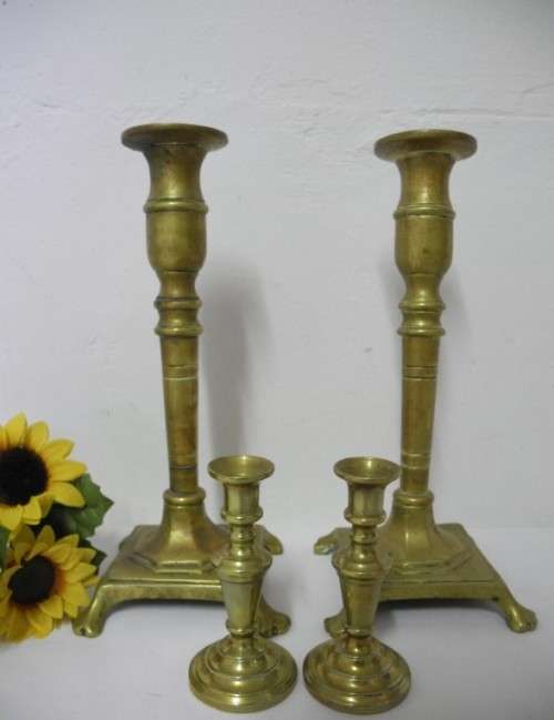 BARGAIN! A wonderful collection of 4 different shapes and sizes brass candle holders