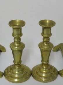 BARGAIN! A wonderful collection of 4 different shapes and sizes brass candle holders