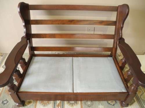 A colourful blue vintage Imbuia 2 seater couch - perfect in a lounge/patio/lapa.