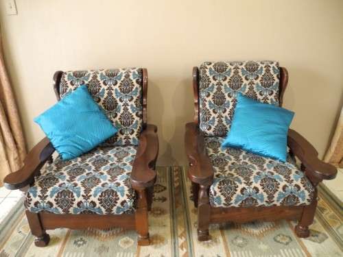 A pair of fabulous floral cushioned vintage Imbuia chairs - perfect in a lapa/patio.