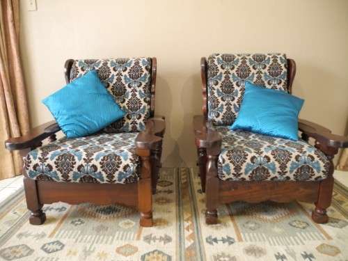 A pair of fabulous floral cushioned vintage Imbuia chairs - perfect in a lapa/patio.