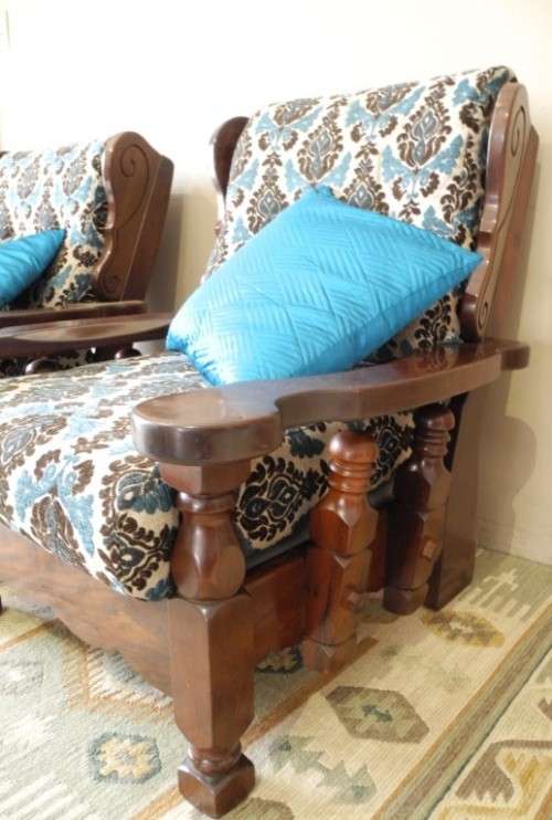 A pair of fabulous floral cushioned vintage Imbuia chairs - perfect in a lapa/patio.