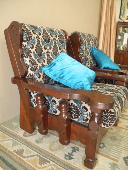 A pair of fabulous floral cushioned vintage Imbuia chairs - perfect in a lapa/patio.