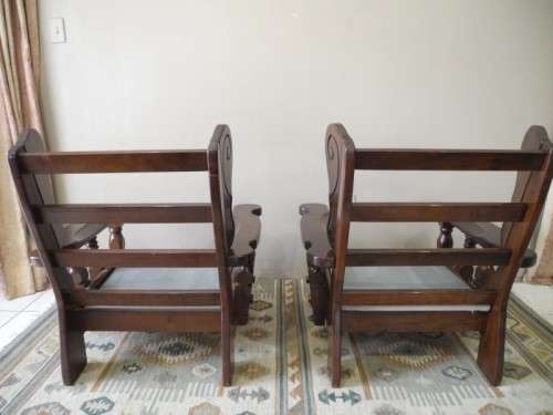 A pair of fabulous floral cushioned vintage Imbuia chairs - perfect in a lapa/patio.