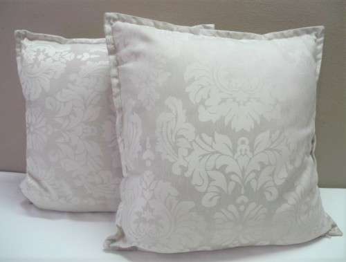 A pair of beige stylish upmarket, modern scatter cushions. One bid for both