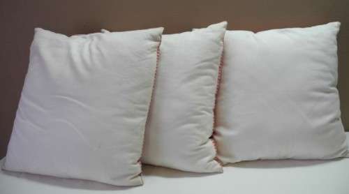 A set of three red and white stylish upmarket, modern scatter cushions. One bid for all.
