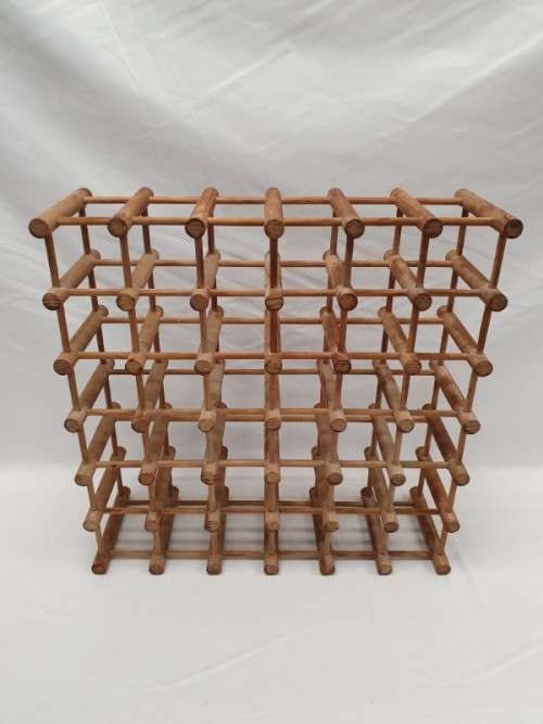 Stylish and practical table-top wooden wine rack with space for 36 wine bottles.