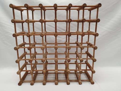 Stylish and practical table-top wooden wine rack with space for 36 wine bottles.