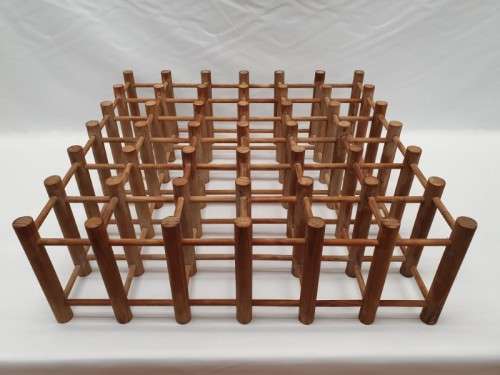 Stylish and practical table-top wooden wine rack with space for 36 wine bottles.