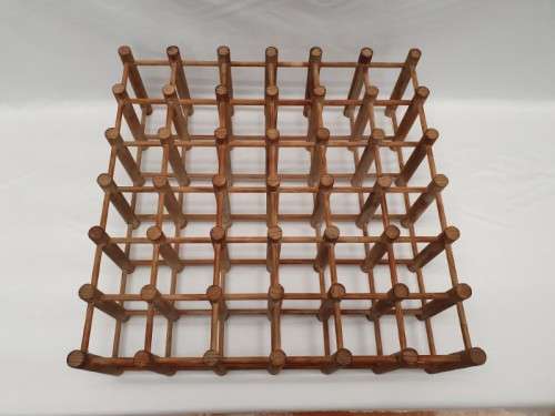 Stylish and practical table-top wooden wine rack with space for 36 wine bottles.