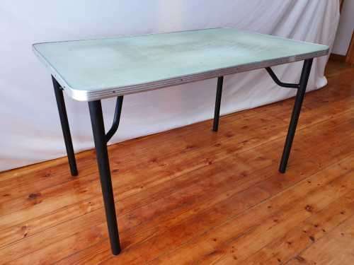 A vintage linoleum six seater table perfect for a garden, patio/ lapa etc