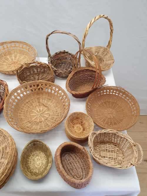 An assortment of table/ flower/ bread baskets, paper plate holders
