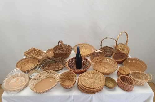 An assortment of table/ flower/ bread baskets, paper plate holders