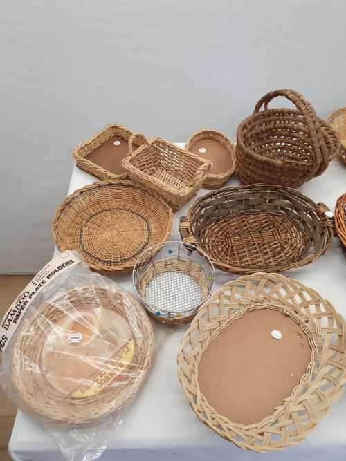 An assortment of table/ flower/ bread baskets, paper plate holders
