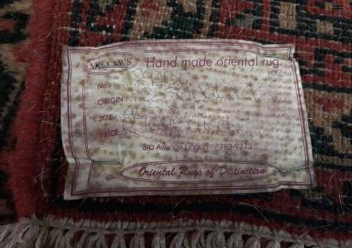 A stylish Hossenabad Persian runner carpet (80cm x 397cm).